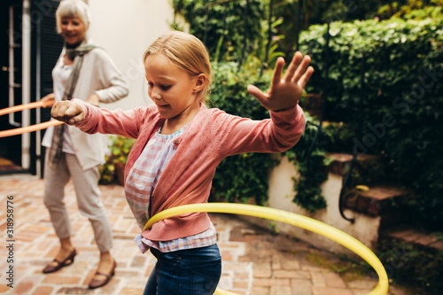 Woman and child playing with hoopla rings