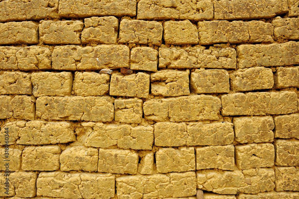 Fototapeta premium Old wall made with mud dried bricks.