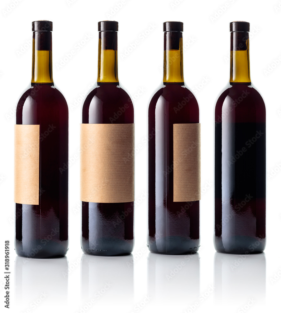 Red wine bottle with old paper label isolated on white.