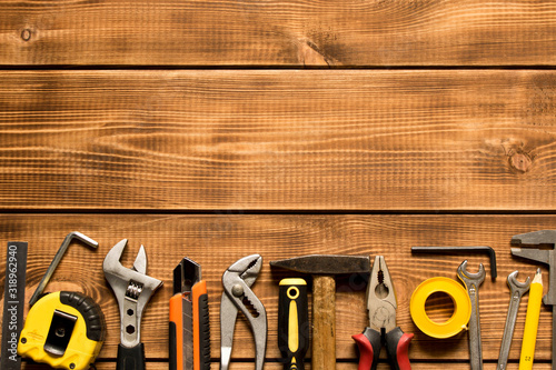Labor day. Various tools on a wooden background. The concept of labor day.