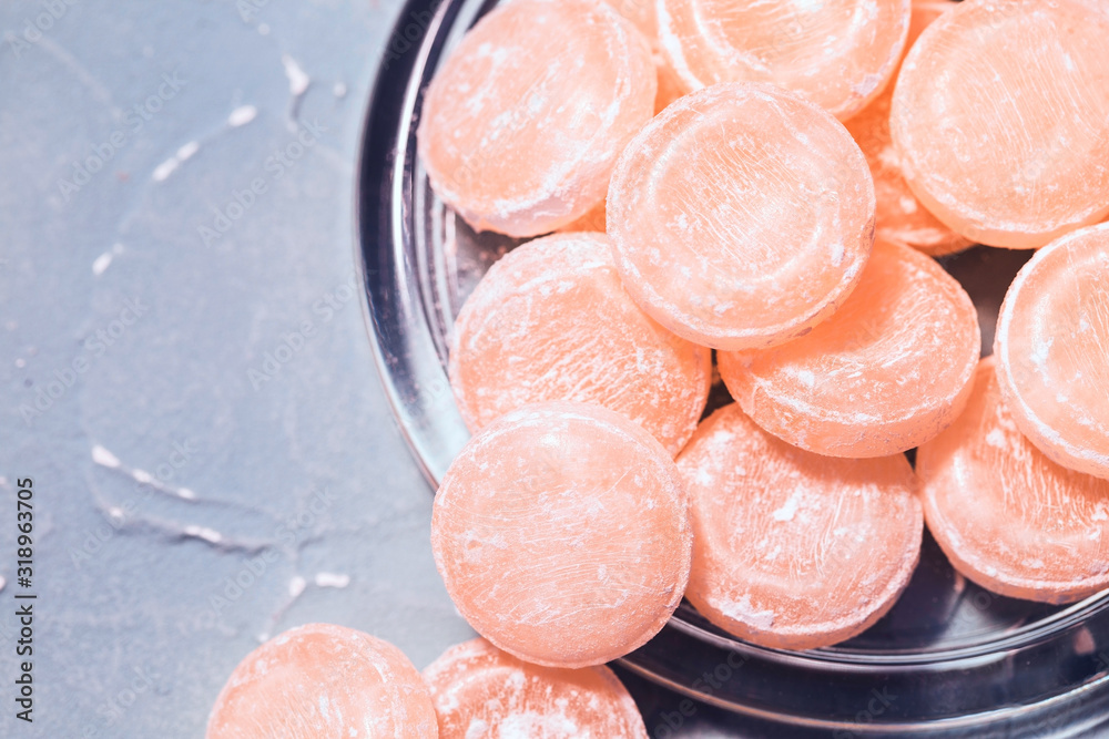 Fototapeta premium Grapefruit throat lozenges, sweet mint drops with citrus flavor