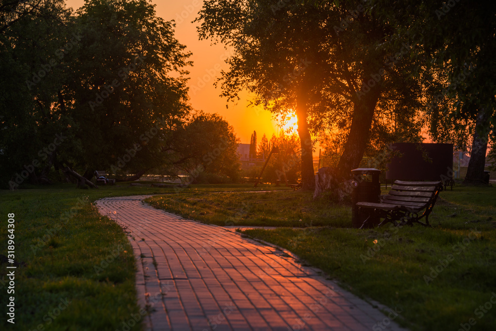 Beautiful sunset scene with pedestrian walkway in Kegums town, Latvia