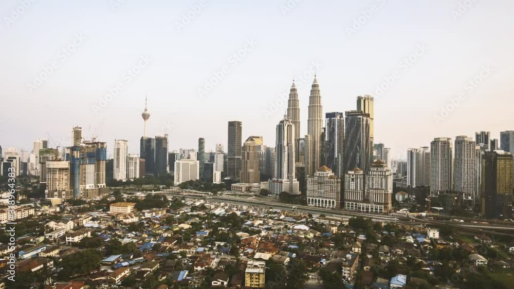 4k time lapse of sunset day to night scene at Kuala Lumpur city skyline. Zoom in