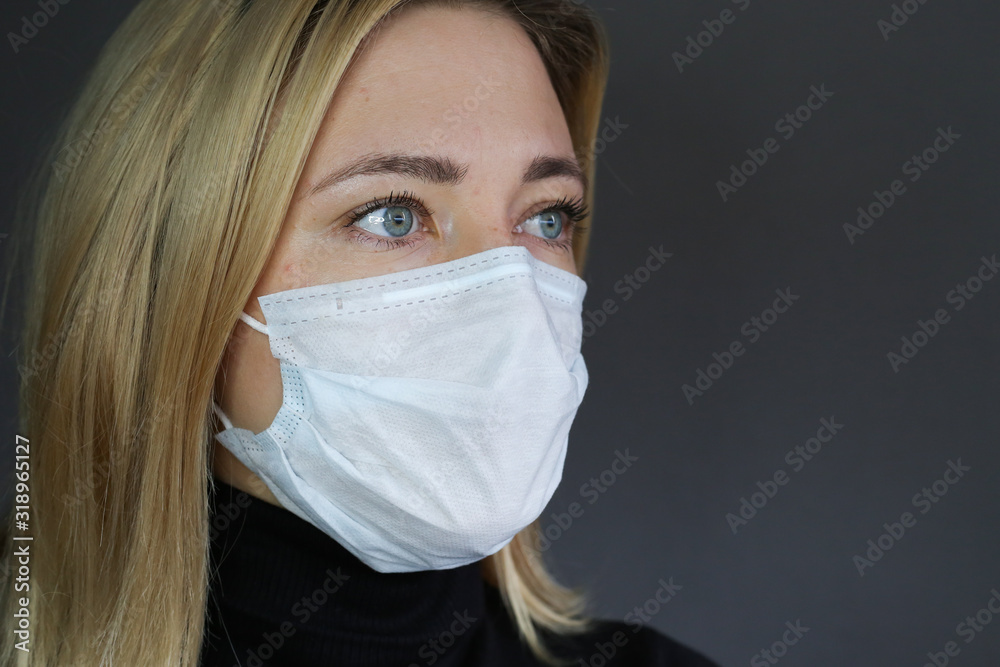 Sick woman wear a medical face mask against virus and protecting herself. Self protection. Dislike sign. Sick woman wear a medical face mask against virus and protecting herself. Self protection. Dislike sign.