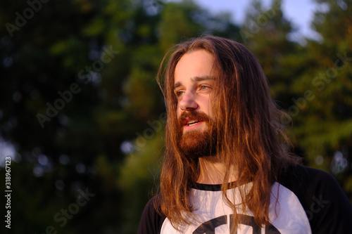 Tableau sur toile Portrait of handsome bearded young man with long hair