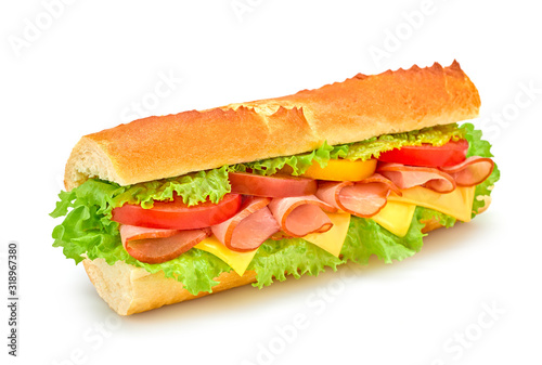 Fresh submarine sandwich with ham, cheese, tomato, lettuce salad, isolated on white. Colorful tasty baguette homemade large sub sandwich with vegetables. Fast food concept
