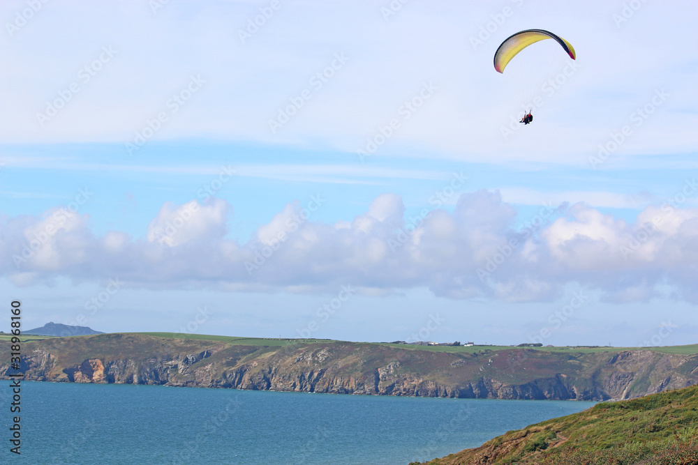 Paraglider above Newgale Beach, St Brides Bay, Wales Paraglider above Newgale Beach, St Brides Bay, Wales