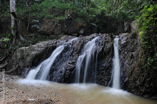 Waterfall stream in a deep rain forest.