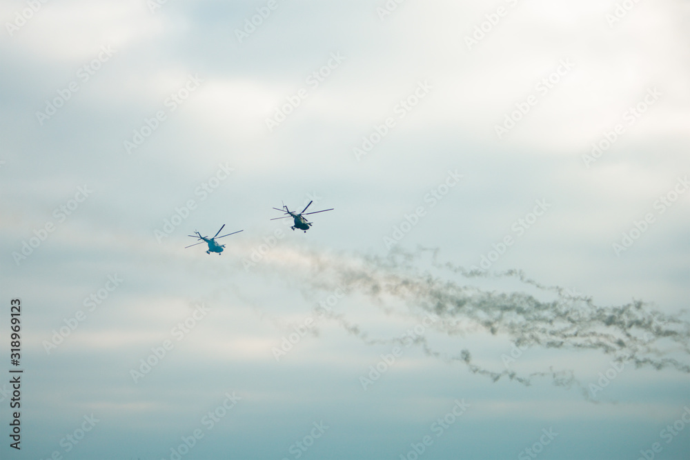 Obraz premium Military helicopter fired anti-armor missiles at sunset