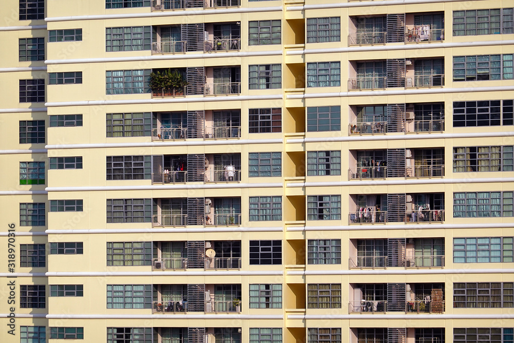 Fototapeta premium Building with many balconies and windows.
