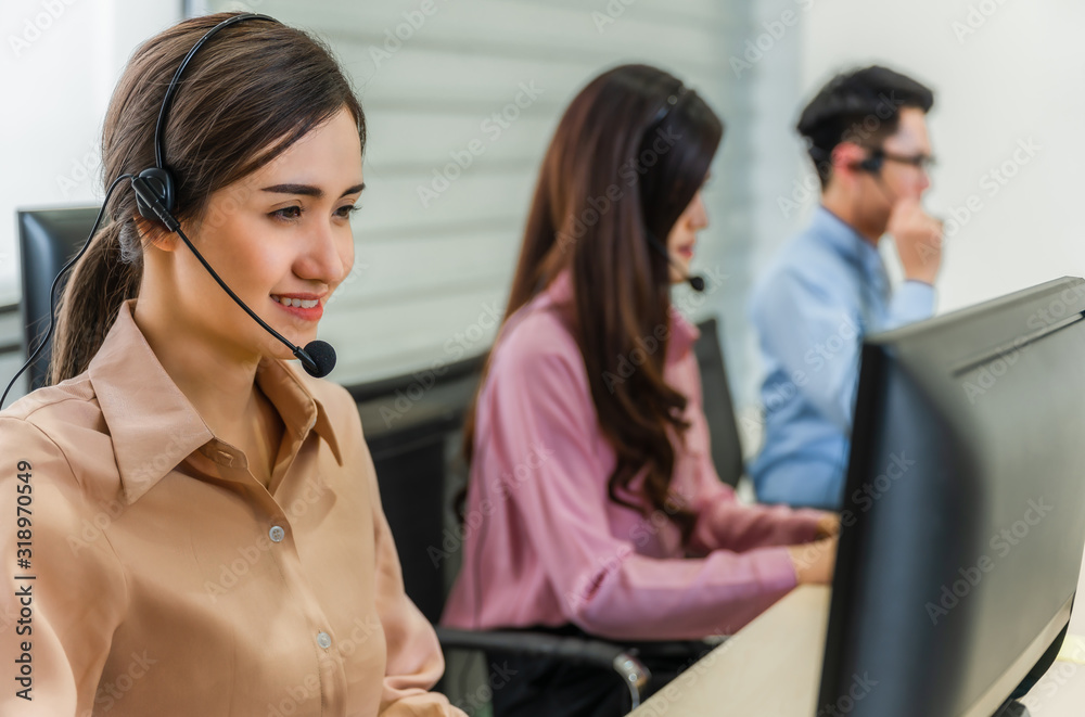 Call center operators. Beautiful asian woman and teamwoek working service consulting clients Call center operators. Beautiful asian woman and teamwoek working service consulting clients