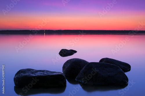 sunset sky over the lake. Evening lake. Pink sky