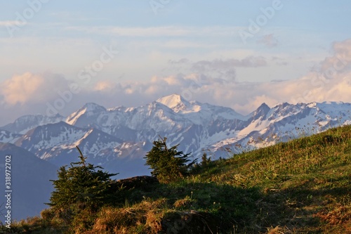 beautiful sunrise on the mountains in spring with blue sky and view to the alps