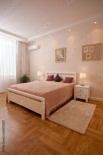 epmty minimalistic interior background, bedroom of modern apartment with big mirrors, double bed, lights on
