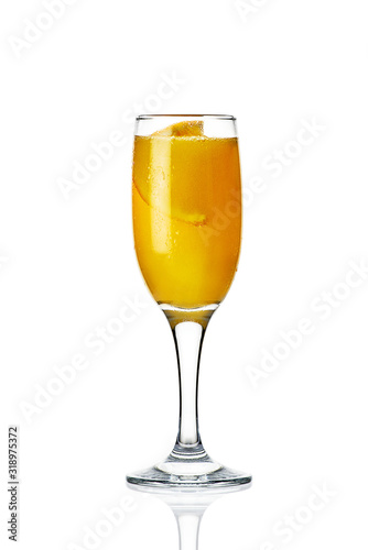 orange cocktail in a glass on a white background