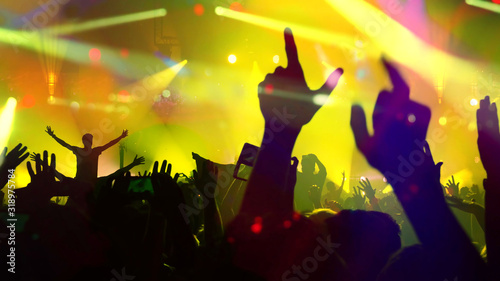 Concert Music festival and Celebrate. Party People Rock Concert. Crowd Happy and Joyful and Applauding or Clapping. Celebration party festival happiness. Blurry night club. Concert Show with DJ Music 
