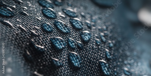 Close-up view on water drops on waterproof impregnated fabric. photo