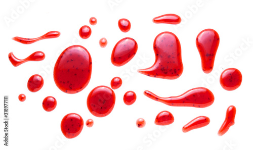 Obraz na płótnie red raspberries jam splash isolated on white background