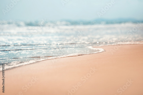 Close-up soft wave of the sea on the sandy beach