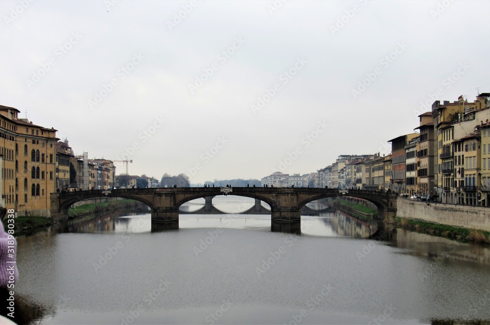 View of the Ponte Santa Trìnita, or the St. Trinity Bridge, as seen from the Ponte Vecchio in Florence, Italy 
