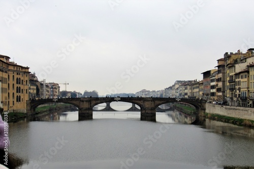 View of the Ponte Santa Trìnita, or the St. Trinity Bridge, as seen from the Ponte Vecchio in Florence, Italy  © Isabel