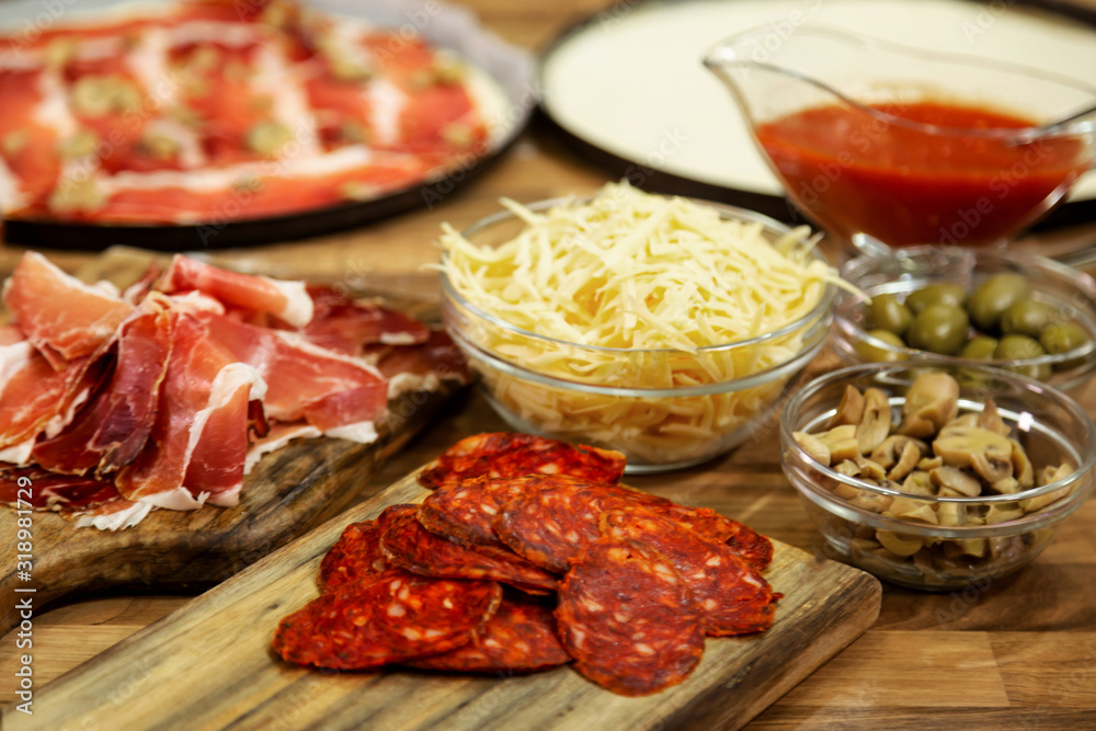 Ingredients for pizza on the table.