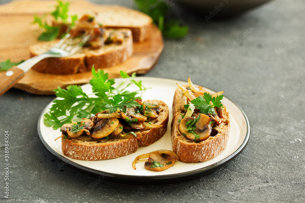 Bruschetta with fried mushrooms with onions and parsley. Bruschetta with fried mushrooms with onions and parsley.