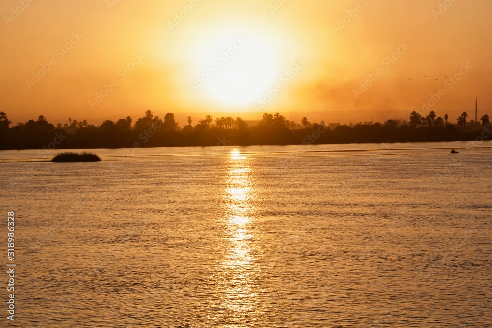 Sunset viewed from across a river