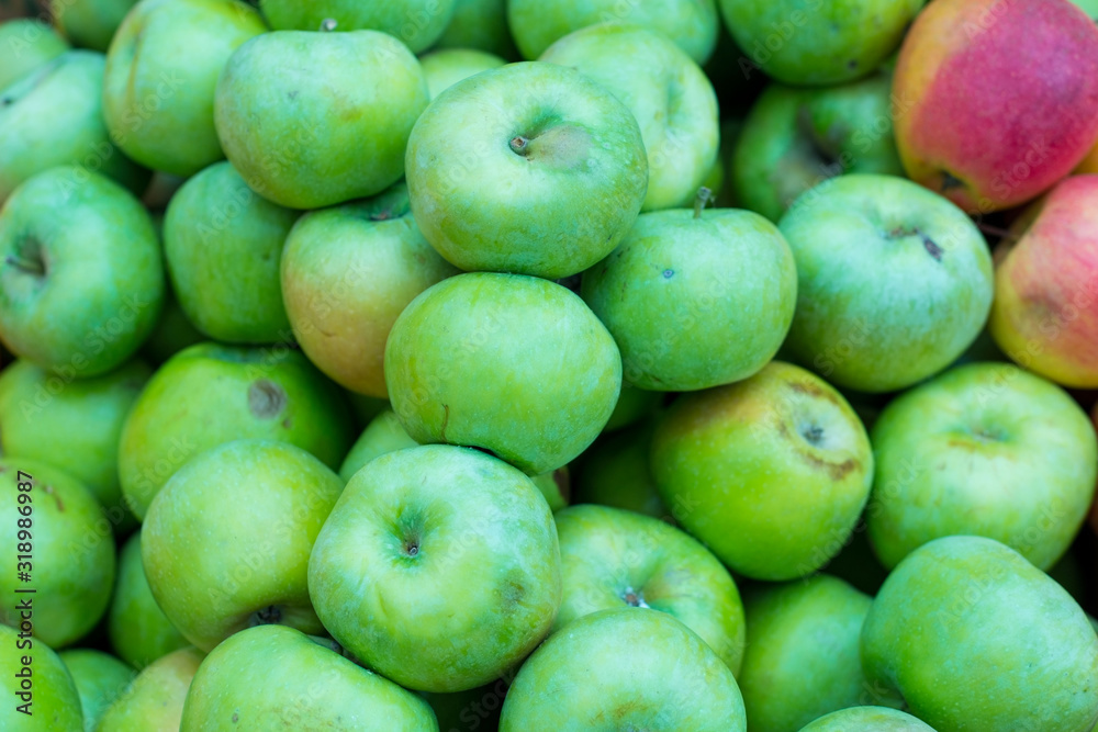 top view texture of apples. Red and green apples, dirty, on a market counter top view texture of apples. Red and green apples, dirty, on a market counter