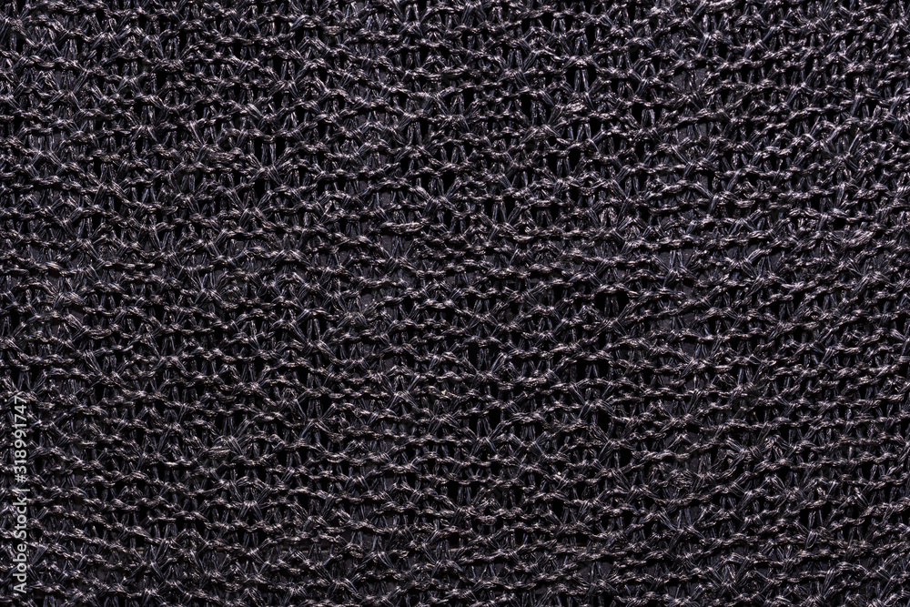 Fototapeta premium dark gray fabric texture knitted on a frame
