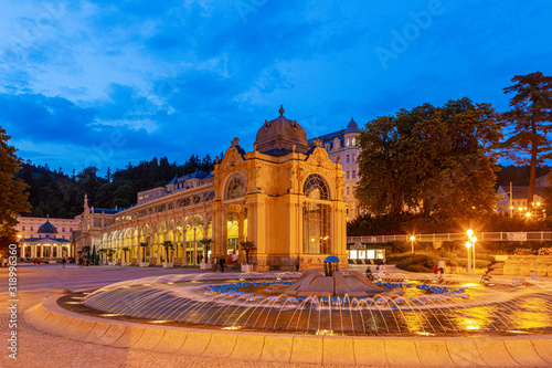View on historic Kolonada building and singing fountain in the Czech spa town Marienbad in evening twillight in summer