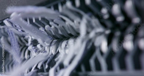 Document being shredded view from side of jaws ripping paper
