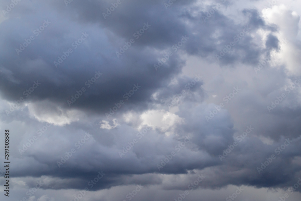 Grey cumulus clouds on blue sky before rain. Grey cumulus clouds on blue sky before rain.