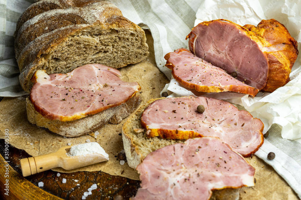 Homemade ham sandwiches on a craft vintage surface