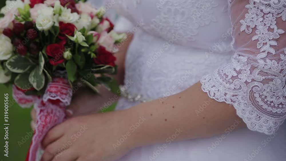 Happy newlyweds caress each other's hands. Happy newlyweds caress each other's hands.