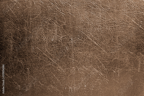 dark leather background in vintage style, dust and scratches