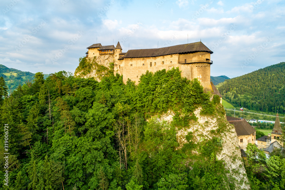 Orava castle - Oravsky Hrad in Oravsky Podzamok in Slovakia. Medieval fortress on extremely high and steep cliff. Aerial view