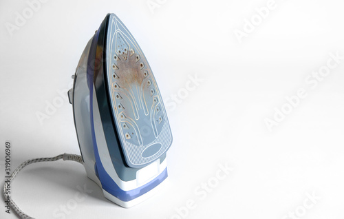 used dirty iron not suitable for ironing. home appliance service concept