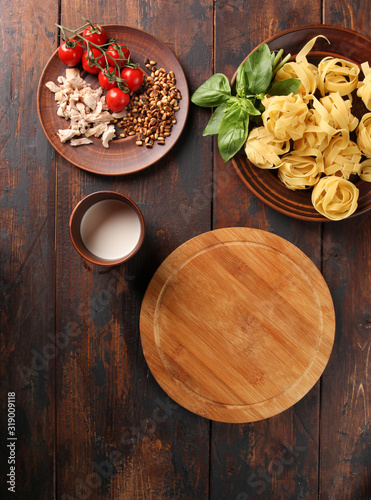 The concept of Italian cuisine. Pasta on a dark wooden background. Copy space