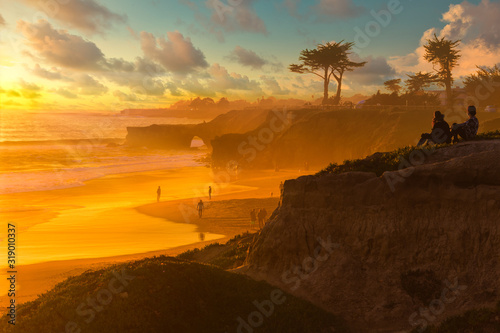 Fototapeta Naklejka Na Ścianę i Meble -  Colorful sunset over Natural Bridges beach in Santa Cruz California