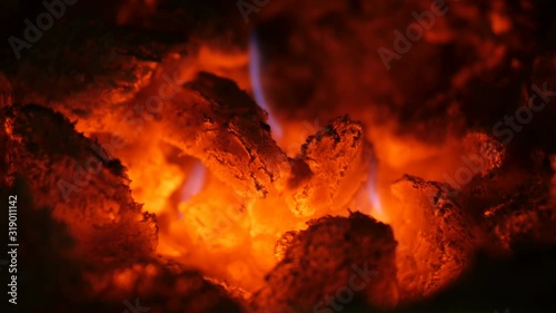Black charcoal texture, red-hot natural mineral resource background,smoldering hot coals in the stove