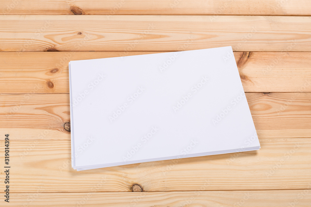 white paper on wood background and shadow white paper on wood background and shadow
