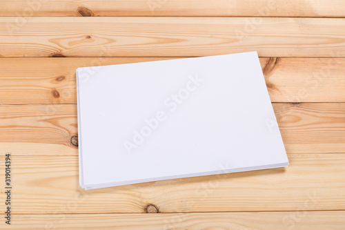 white paper on wood background and shadow