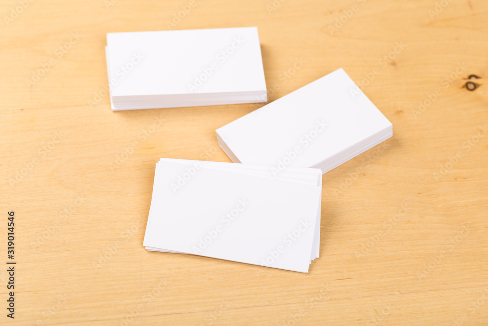 Photo of blank business cards on a general background. Template for identifier. View from above. mock up Photo of blank business cards on a general background. Template for identifier. View from above. mock up