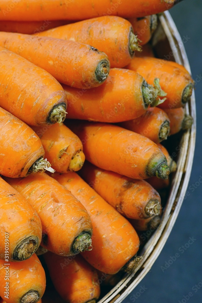 Fresh orange carrots for sale at a farmers market Fresh orange carrots for sale at a farmers market