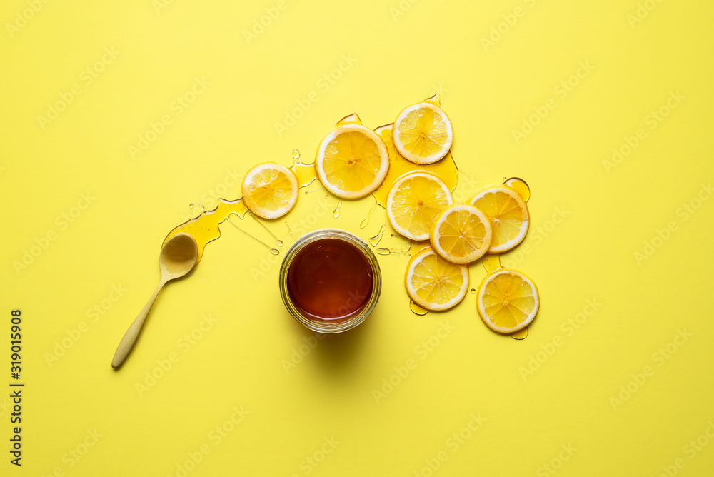 Lemon slices and honey jar. Healthy eating. Natural cold remedy