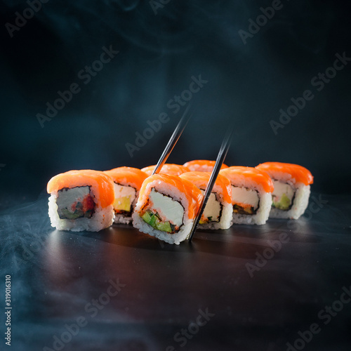 Sushi filadelfia on black background