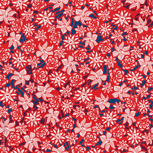 A seamless vector pattern with summer flowers, orchids and roses in red, white and navy blue. Decorative vibrant surface print design. Great for fabrics, cards, wrapping paper and packaging.