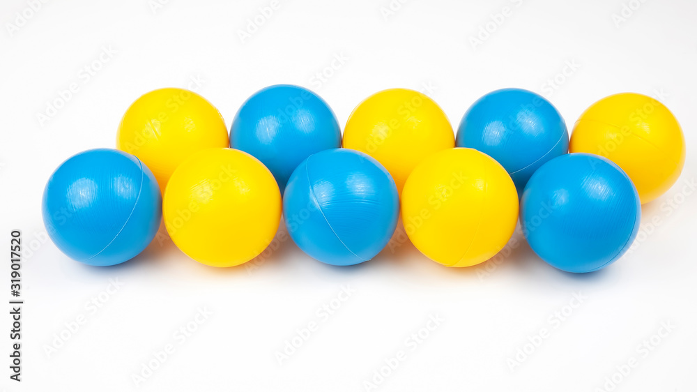 Colored plastic balls on white background. leisure and game items. round objects Colored plastic balls on white background. leisure and game items. round objects