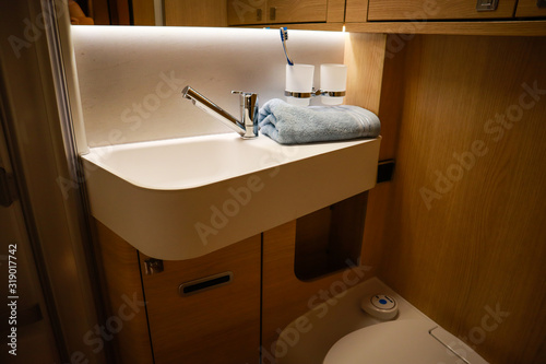 Interior of luxury caravan. Detail photo of coach with equipment.Kitchen